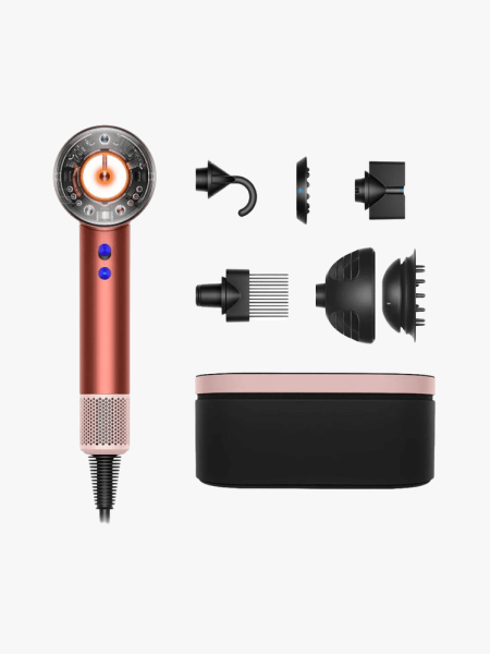 Dyson Special Edition Supersonic Nural Hair Dryer in Strawberry Bronze and Blush Pink in branded components on a light gray background